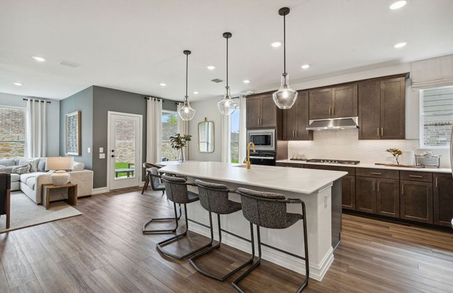 Bright kitchen with an expansive center island perfect for gatherings *Model representation | Image 4