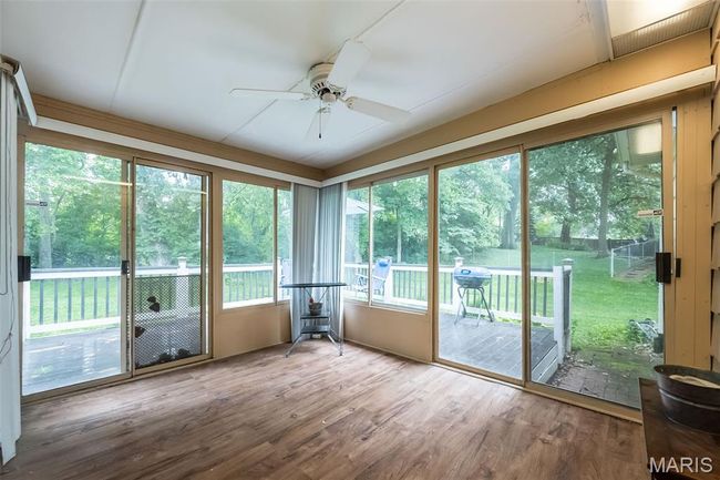 Unfurnished sunroom with ceiling fan | Image 18