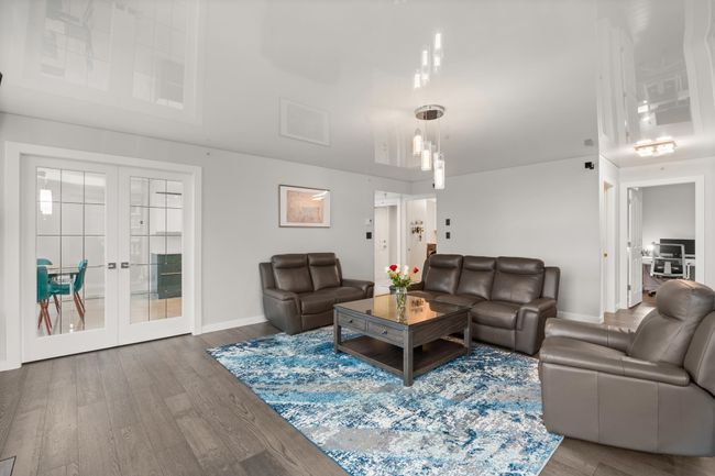 Living area with french doors, baseboards, and wood finished floors | Image 9