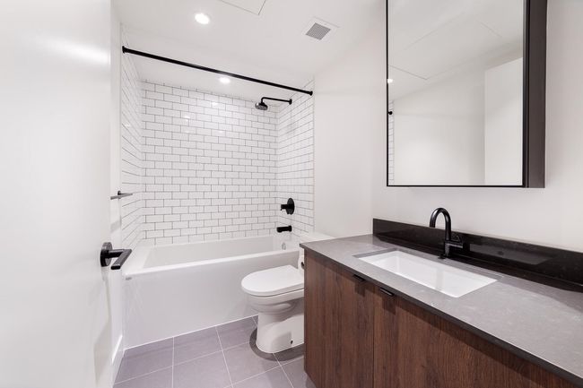 Full bathroom with vanity, shower / tub combination, tile patterned floors, and recessed lighting | Image 29
