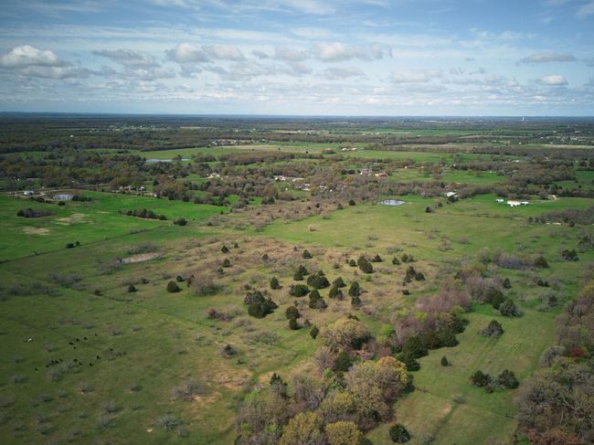 Other aerial view shows a pond. | Image 12