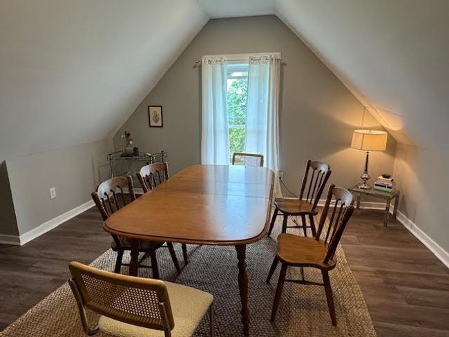 Dining room with wood finished floors and vaulted ceiling | Image 23