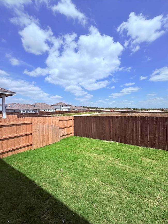 View of yard featuring a fenced backyard | Image 39