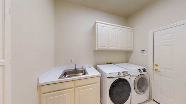 Utility room - pocket-door entry, sink and built-in ironing board | Image 18