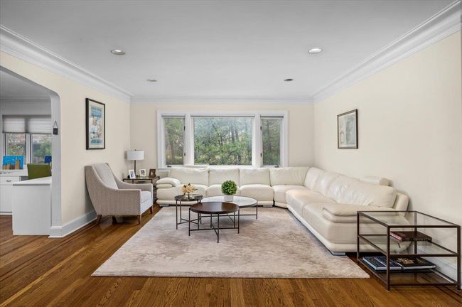 Living area featuring recessed lighting, crown molding, lots of light and wood finished floors | Image 8