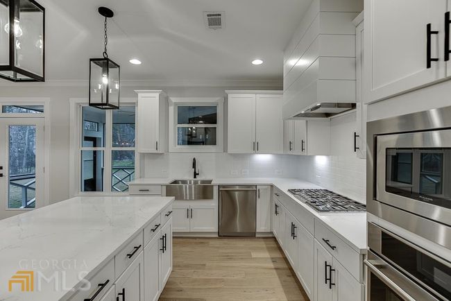 7030 Majors Rd, House other with 5 bedrooms, 3 bathrooms and 4 parking in Cumming GA | Image 15