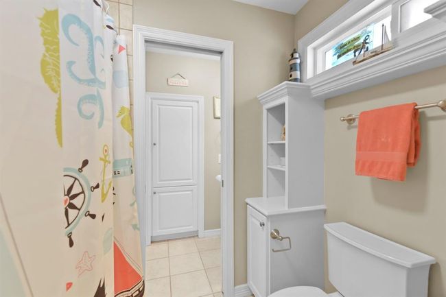 The Jack-and-Jill bathrooms feature separate sinks and convenient pocket doors for added privacy. | Image 33