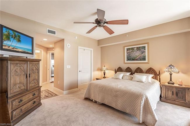 Carpeted bedroom featuring ceiling fan | Image 31