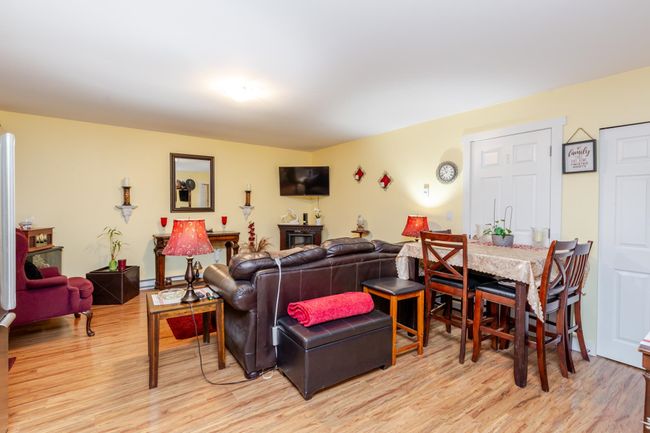 Living room with light wood-style floors | Image 25