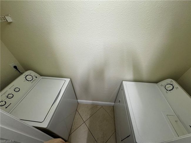 Laundry room featuring washer / clothes dryer and laundry area | Image 17