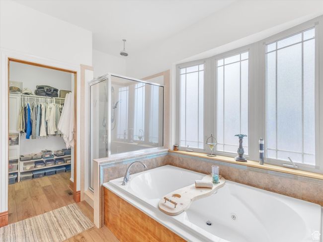 Bathroom featuring a healthy amount of sunlight and a stall shower | Image 20
