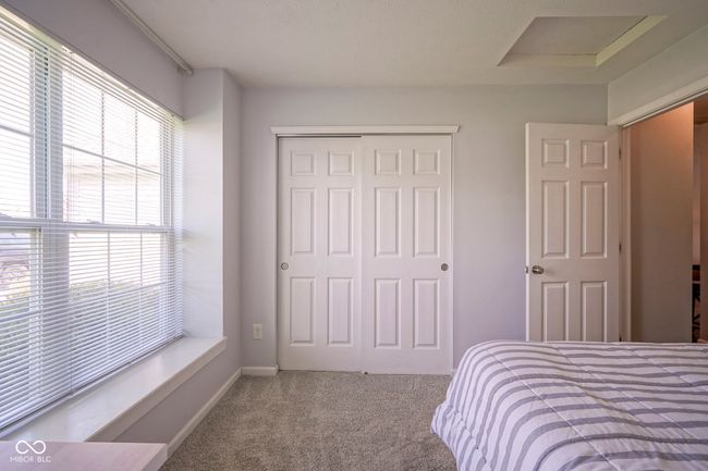 carpeted bedroom featuring a closet | Image 28