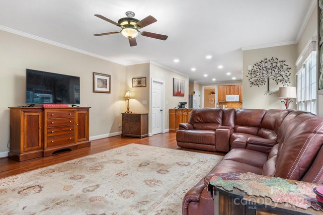 Between living and kitchen is a breakfast area and access to rear deck | Image 9