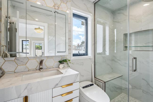 Full bathroom featuring Standup shower, vanity, and tile walls | Image 27
