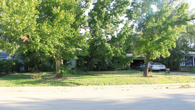 View of yard featuring concrete driveway | Image 4