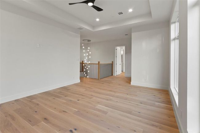 Game room upstairs with view of 2 story chandelier pre wired for surround speakers | Image 30