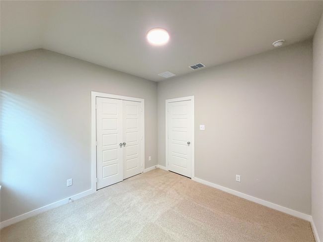 Unfurnished bedroom with light carpet and a closet | Image 28