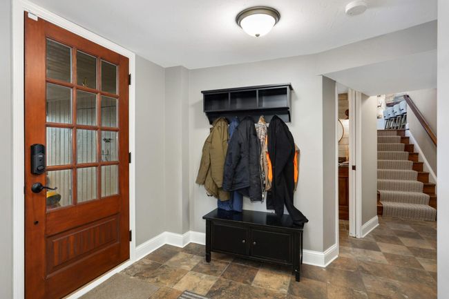 This is the lower level walk out just steps from the lake! Another 3/4 bathroom and laundry room makes this the perfect access to the lake. | Image 36