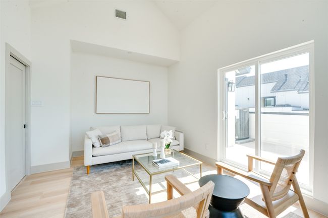 Living room featuring light hardwood / wood-style flooring and high vaulted ceiling | Image 32