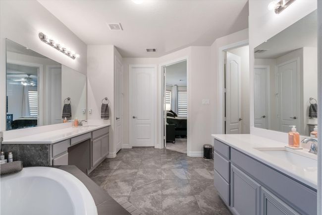 Master bath has an adjoining door to a bedroom, enhancing convenience and flow. | Image 25