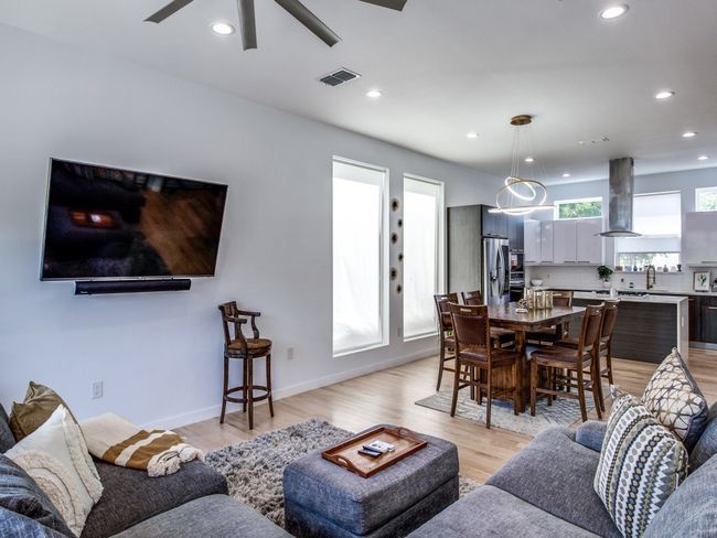 Living room with a ceiling fan, recessed lighting, and light wood-type flooring | Image 5