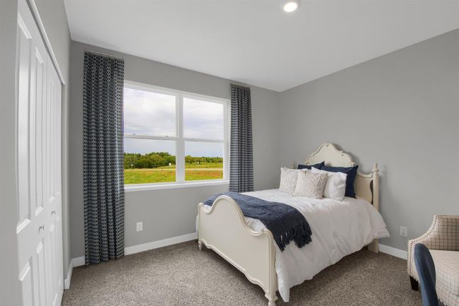 Desirable main floor bedroom perfect for guests or one level living. Model photo. Options and colors will vary. | Image 15