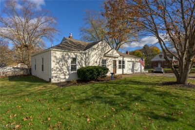 View of front of property featuring a garage and a front lawn | Image 3