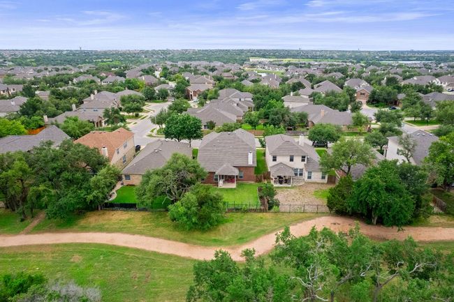 Drone view of greenbelt and trail behind property | Image 32