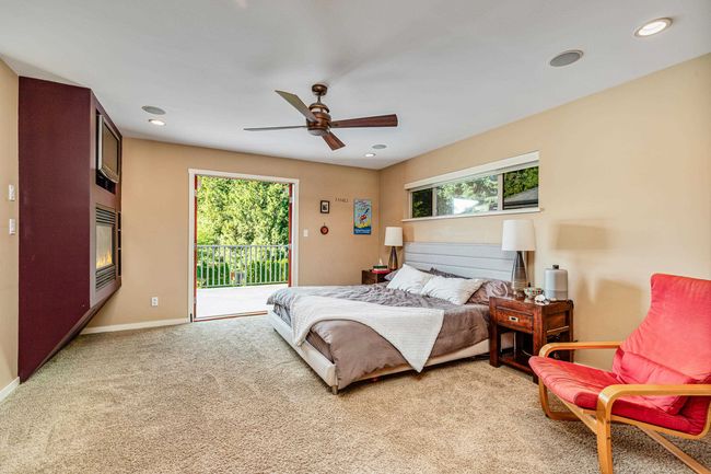 Bedroom with access to outside, light colored carpet, ceiling fan, and recessed lighting | Image 17