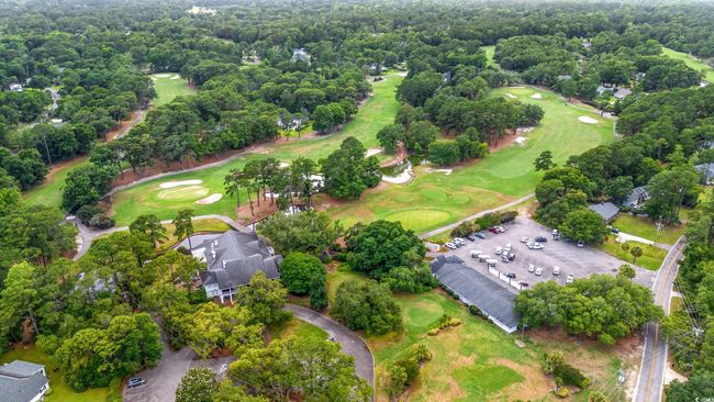 Aerial view of property and surrounding area with a local golf course | Image 39