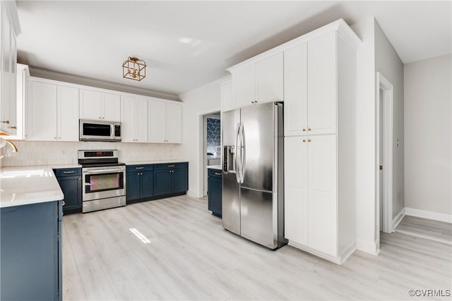 Kitchen with view of half bath | Image 23