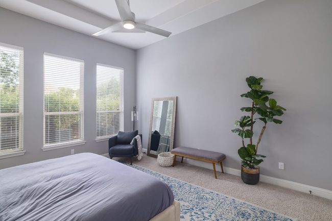 Carpeted bedroom featuring baseboards and a ceiling fan | Image 17