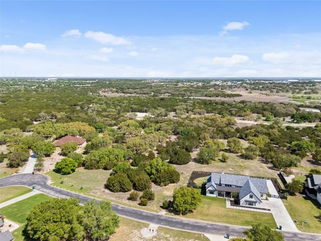Birds eye view of property. Lot is between the two homes. | Image 4