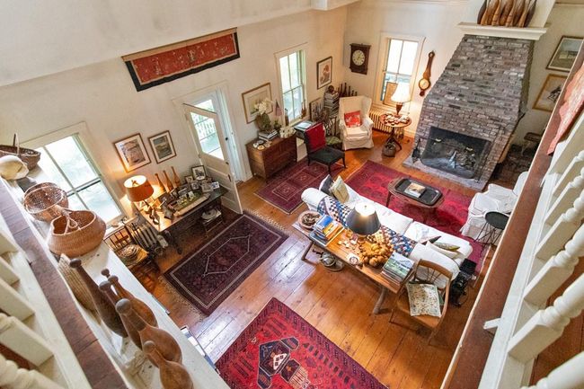 Living room featuring a fireplace and hardwood / wood-style flooring | Image 8