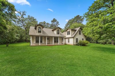 Look at this impressive home on 2 LOTS! Perfect for horse aficionados and those looking for minimal deed restrictions. Plus this home features a shed with 220V! | Image 1