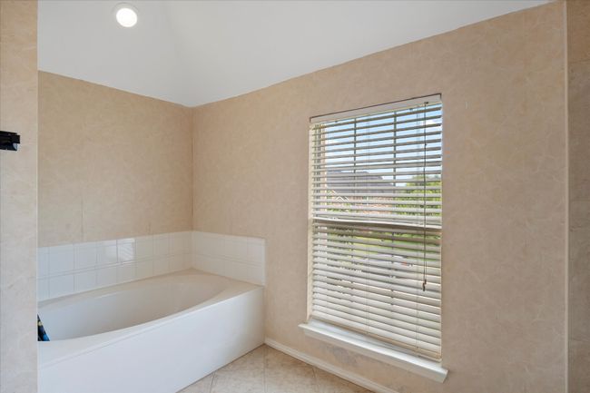 Full bathroom featuring a garden tub and tile patterned floors | Image 29