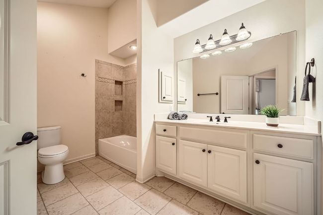 Very Spacious Full Guest bath with vanity and bathtub / shower combination | Image 16