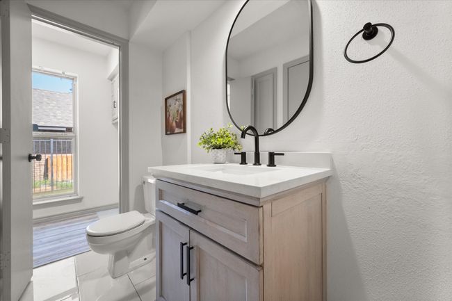 Half bath connects to laundry room. | Image 33