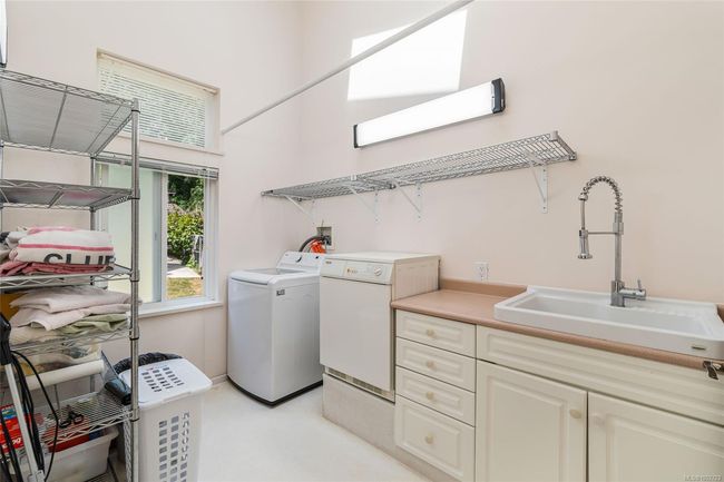 Laundry area with independent washer and dryer and cabinet space | Image 34