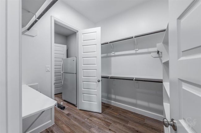 2nd bedroom closet in the primary bedroom with pass through access to the laundry room. | Image 25