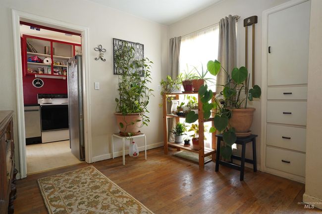 Doorway featuring hardwood / wood-style floors | Image 6