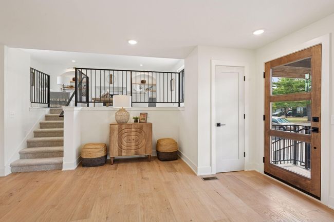 Newly installed engineered white oak flooring in the kitchen, entry & dining areas. | Image 6