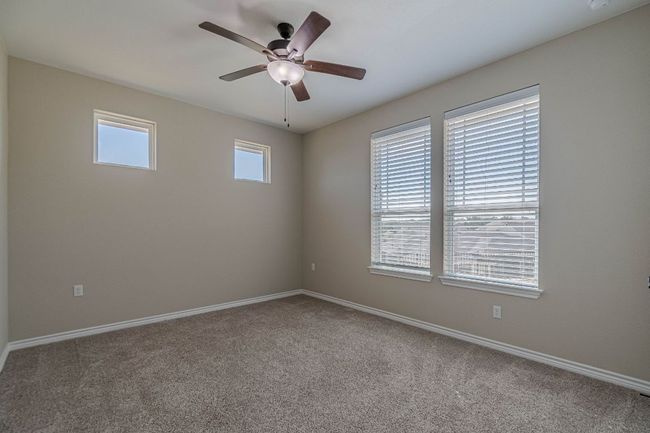 Spare room with carpet and a ceiling fan | Image 9