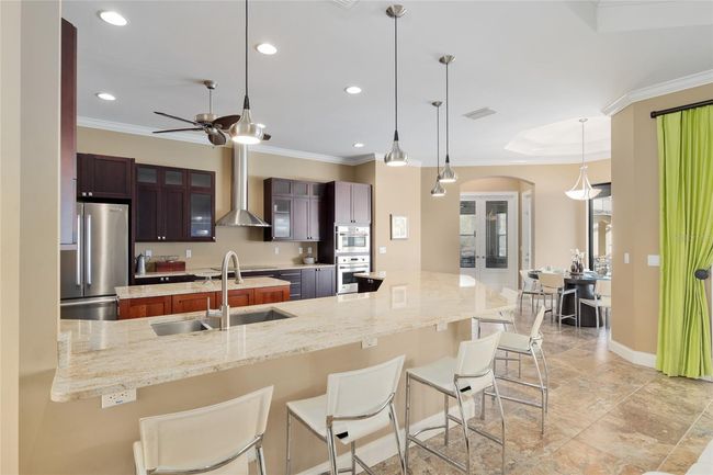 View of kitchen from living room with breakfast nook to the right | Image 36