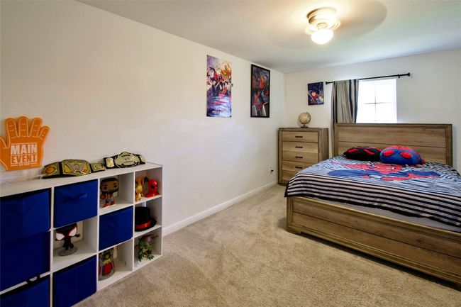 Bedroom featuring light colored carpet and baseboards | Image 22
