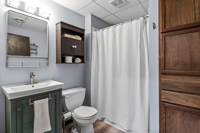 The second bathroom upgrade was done in 2021 and features new flooring, light fixture, vanity, and storage above the toilet. | Image 20
