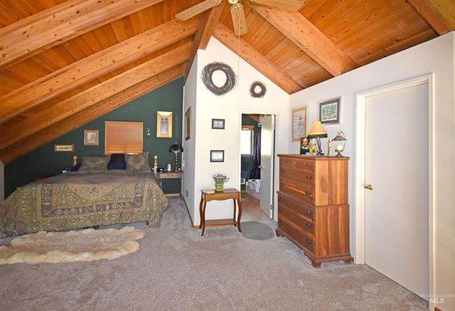 Carpeted bedroom featuring wood ceiling | Image 15