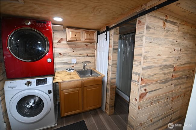 Full laundry setup and extra wash sink for added convenience. | Image 32