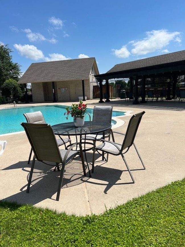 Community pool featuring a patio and fence | Image 39