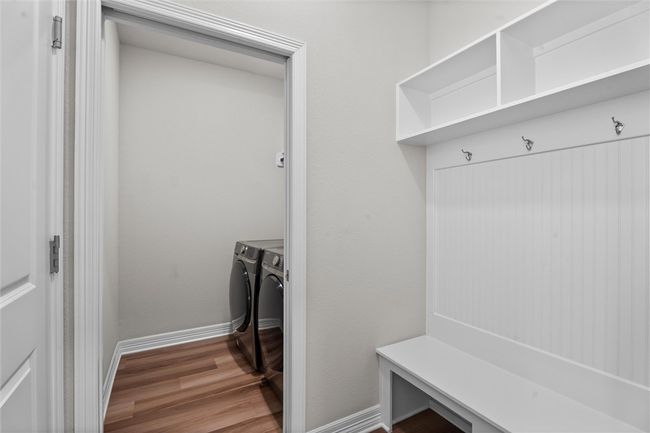 Mudroom with washer and dryer, wood finished floors, and baseboards | Image 27